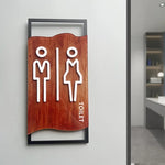 signalisation toilettes moderne symboles homme femme texte TOILET bois brun clair blanc tringle noire