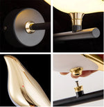 lampe murale oiseau stylisé moderne or noir blanc
