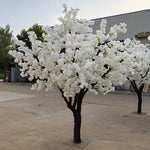 arbre artificiel blanc fleurs tronc brun moderne décoration extérieure mariage photo accueil