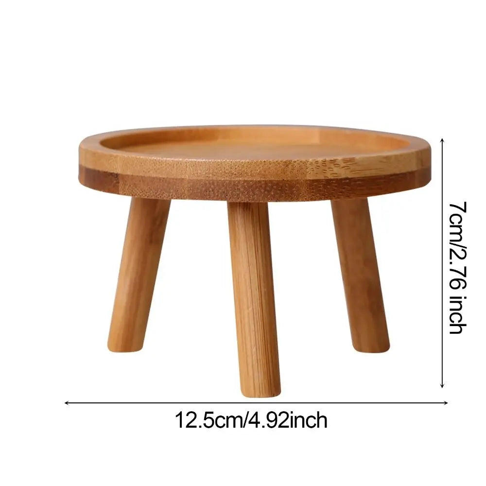 plateau d'appui bois naturel clair moderne petit tabouret trois pieds minimaliste support plante bruns