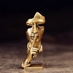 statuette abstraite dorée sculpture visage stylisé moderne décoration salon maison