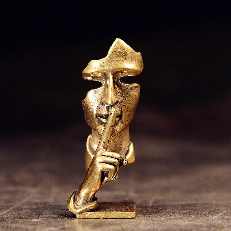 statuette abstraite dorée sculpture visage stylisé moderne décoration salon maison