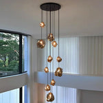 Suspension lumineuse moderne dorée noir formes géométriques brillantes salon chambre