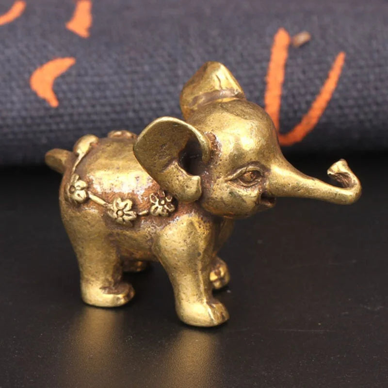 statuette éléphant bronze doré texture peau éléphant motifs floraux traditionnel asiatique décoration maison salon