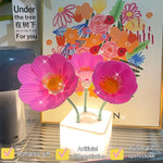 Veilleuse fleur jaune sur table de nuit ambiance tamisée