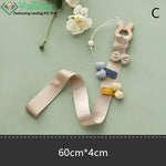 porte accessoires mural moderne rubans clips cheveux motifs floraux pois arc ciel nuages papillons