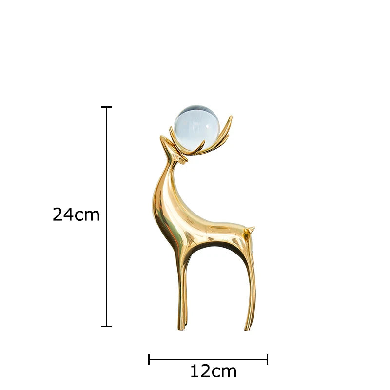 statues cerfs dorées boule cristal moderne décoration vase fleurs artificielles tableau noir
