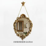 miroir baroque doré ornements sculptés anges chaines decoration maison accessories français