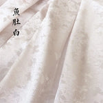 tissu jacquard fleurs blanches vert bleu clair rose pâle kimono traditionnel opaque polyester élasthanne