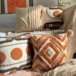 taies d'oreiller géométriques brodées boho chic couleurs beige orange gris franges respectueuses environnement decoration