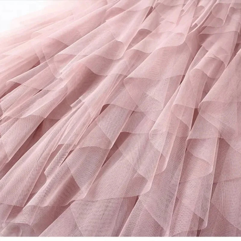 jupe plissée rose clair tulle élégante féminine streetwear élastiquée mi mollet translucent anneaux suspension