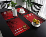 Motif détaillé fleur noire abstraite sur set de table rouge