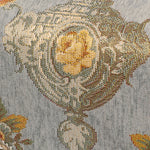L'image montre un motif complexe de formes et de couleurs, composé de détails qui évoquent une ornementation décorative ou textile.