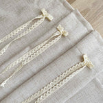 rideau polyester opacité beige clair texture lin bordure dentelle classique rustique