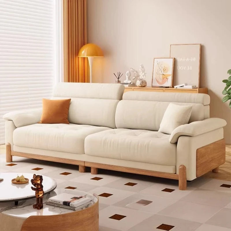 canapé places minimaliste moderne beige clair coussins ajustables table basse bois textures douces surpiqures