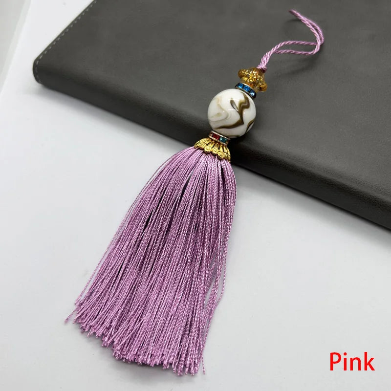 pompon décoratif gris bleu doré vert violet tissu finement tressé élégant moderne blanche chaîne