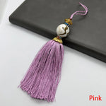 pompon décoratif gris bleu doré vert violet tissu finement tressé élégant moderne blanche chaîne