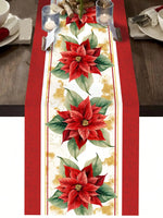 Une magnifique table de fête décorée de jolies fleurs de poinsettia rouges éclatantes sur un chemin de table blanc et doré.