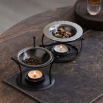 support bougie moderne structure géométrique noir sans holder bougie allumée plat métallique