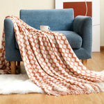 couverture tricotée vert foncé motif zigzag pompons canapé lit décoration intérieure moderne large
