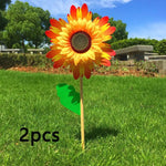 décoration extérieure fleur artificielle jaune rouge bleu vert rayonnante pétale verte tringle jardin cour