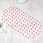 Vue de dessus du tapis de bain antidérapant montrant les ventouses au dos