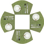 Set de table vert dans une décoration de salle à manger moderne
