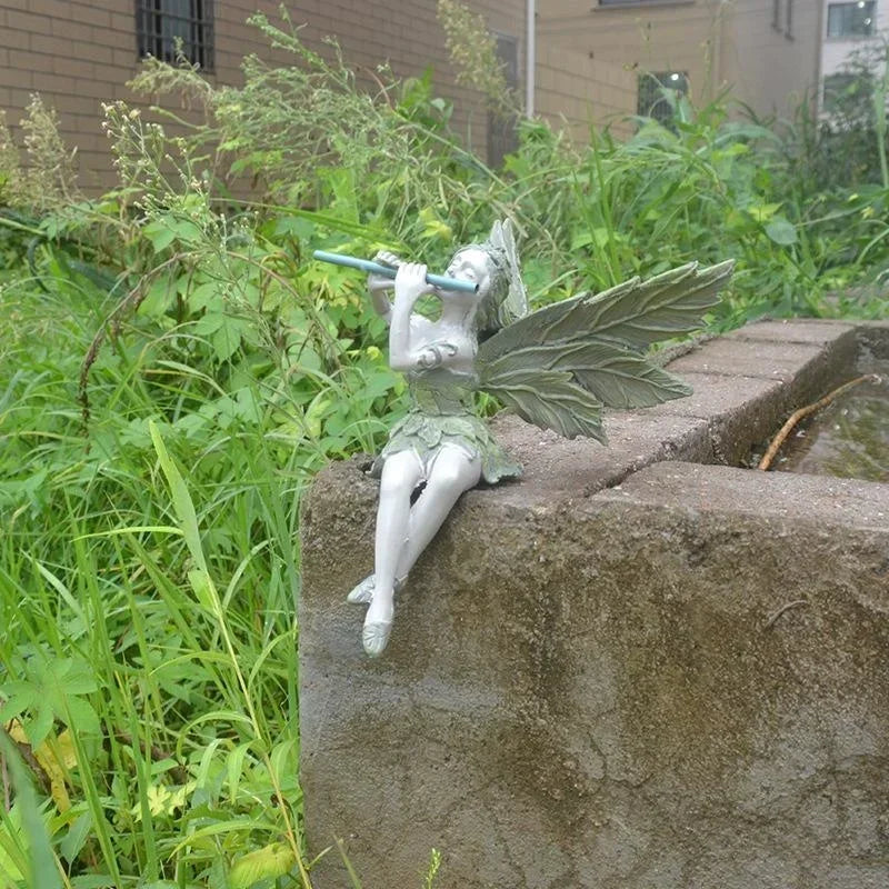 statue fée flûte résine fantaisiste feuilles détails sculptés jardin ornement erotique