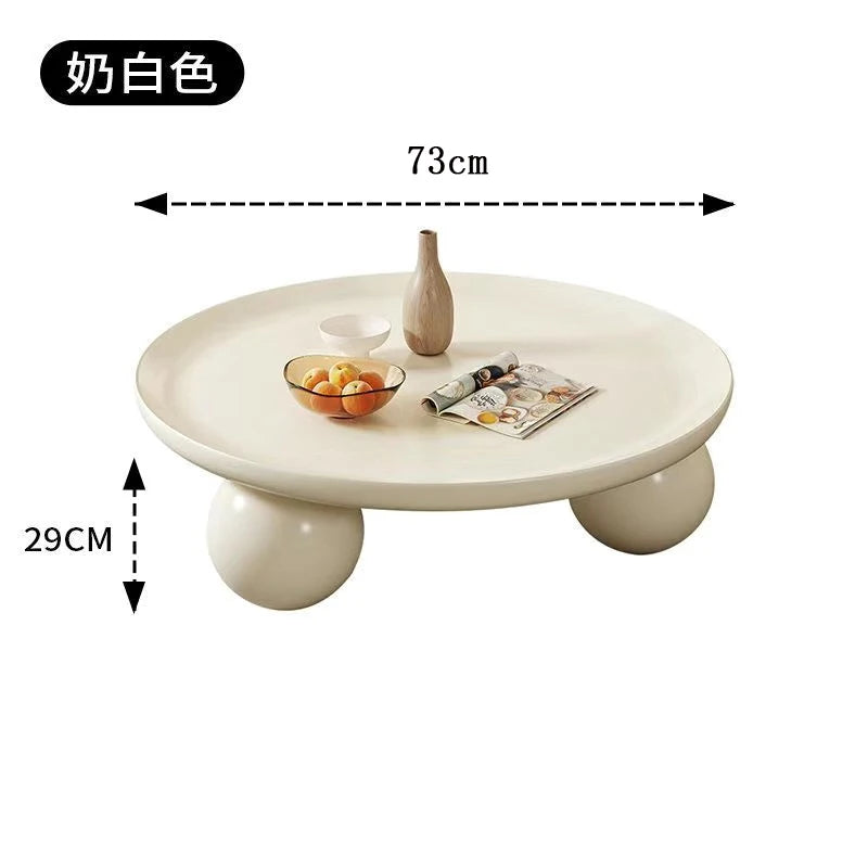 table basse ronde moderne pieds sphériques diamètre 75cm noir blanc cassé tulipes roses fleurs