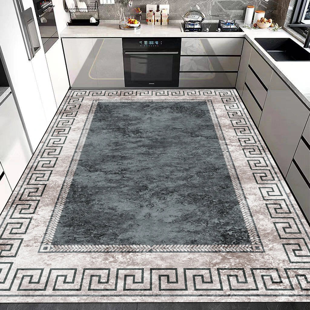 Tapis gris et blanc décoré de motifs géométriques dans une cuisine moderne et élégante.