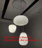 lampe table moderne verre blanc motif rayures horizontales pied bois salon intérieur