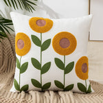 coussins carrés brodés motifs floraux modernes toile blanc jaune vert rouge bleu opaques