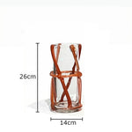 vase moderne transparent tiges entrelacées orange sans fleur