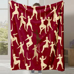 Ce plaid rouge vif est orné de silhouettes aux mouvements dynamiques, créant une impression de célébration et de joie.