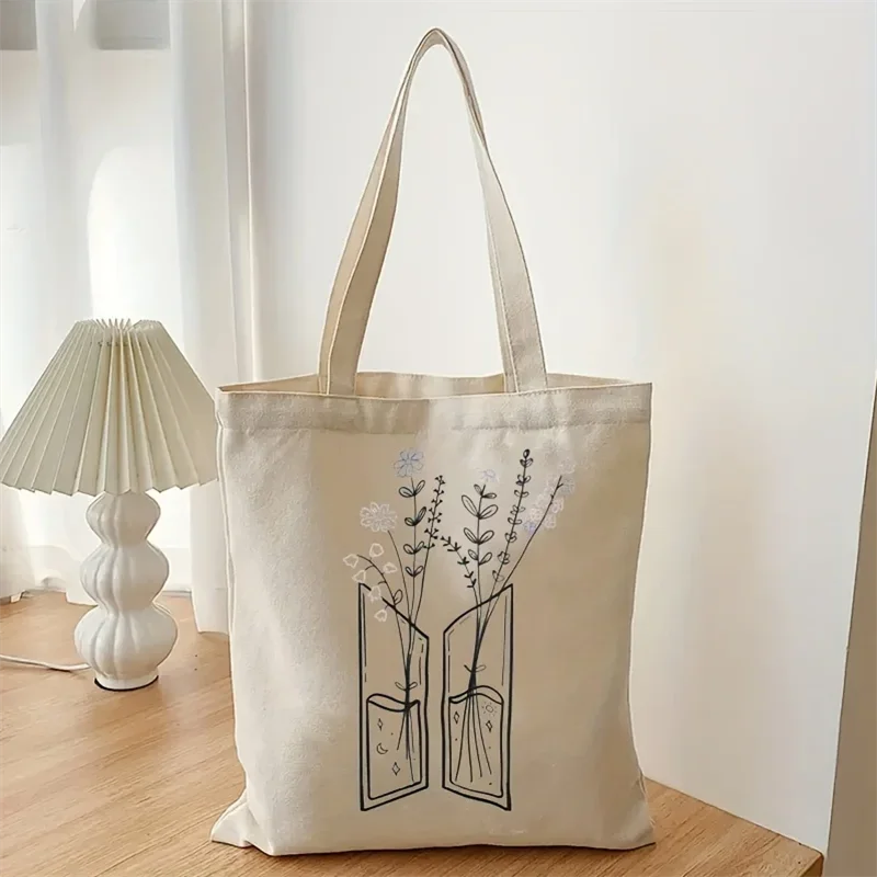 sac main toile beige motif floral ouvert minimaliste poignées fourre tout décontracté