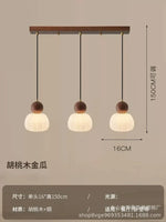 suspension lumineuse trois abatjour bois foncé blanc laiteux moderne minimaliste
