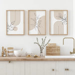 tableaux modernes minimalistes toile lignes géométriques feuilles stylisées beige noir blanc chambre salon