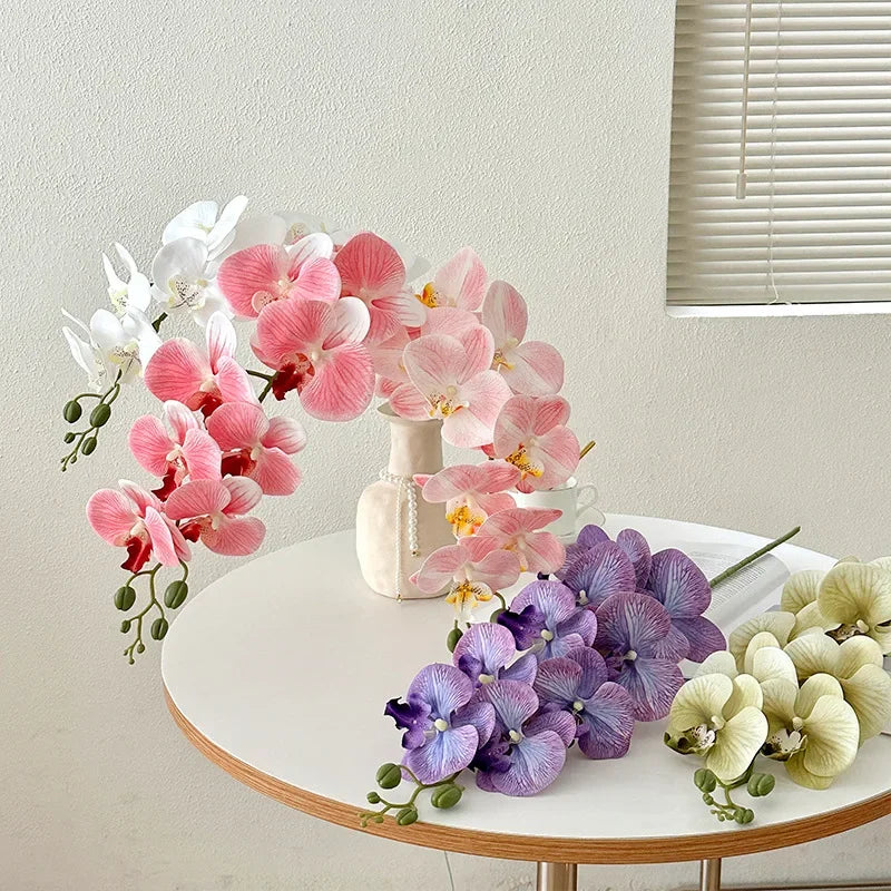 décoration intérieure vase orchidées artificielles fleurs douces feuilles vertes moderne élégant rose blanc violet