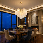 chandelier moderne or opalescent lumière blanche chaîne suspension élégante chambre salon