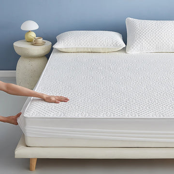 Housse de matelas imperméable 140x200 couleur unie sur lit