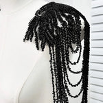 accessoire textile broche franges rouge or noir élégant chic festive decoration