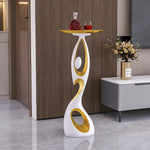table basse moderne artistique plateau rond noir or blanc
