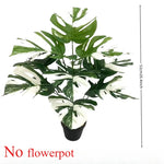 feuilles artificielles monstera vert nervures blanches décoration intérieure moderne trois pièces
