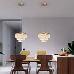 lampe suspendue cristal doré moderne élégante câbles suspendus salon chambre