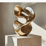 Sculptures abstraites métal doré modernes minimalistes socle noir texturées lumineuses