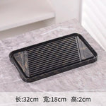 assiettes marbrées modernes élégantes lignes dorées noir blanc thé maison salon