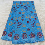tissu dentelle coton brodé fleurs motif broderie africaine voile suisse vêtement élégant