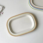 assiettes ovales rayées blanc bleu orange brun vaisselle classique décoration table servir plats après