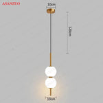 suspension lumineuse moderne sphères translucides blanc doré chambre salon minimaliste