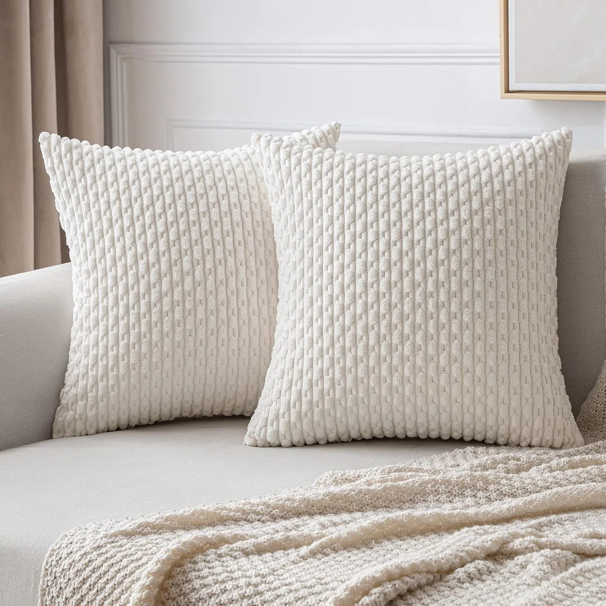 coussins carrés vert clair beige rose pâle texture tissée pompons moderne fermeture glissière